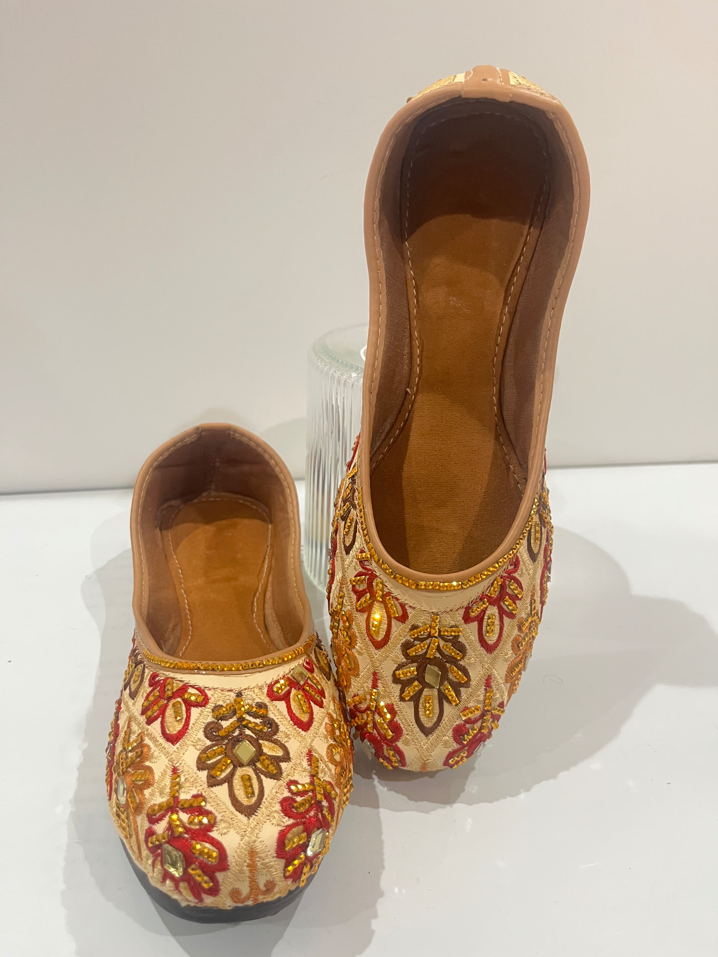 Embroidered khussas in gold, red and brown